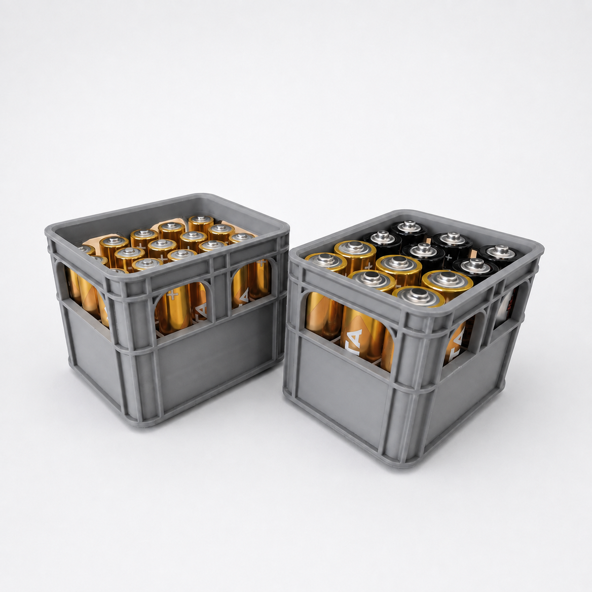 Two gray plastic battery crates filled with cylindrical batteries, photographed on a clean white studio background.