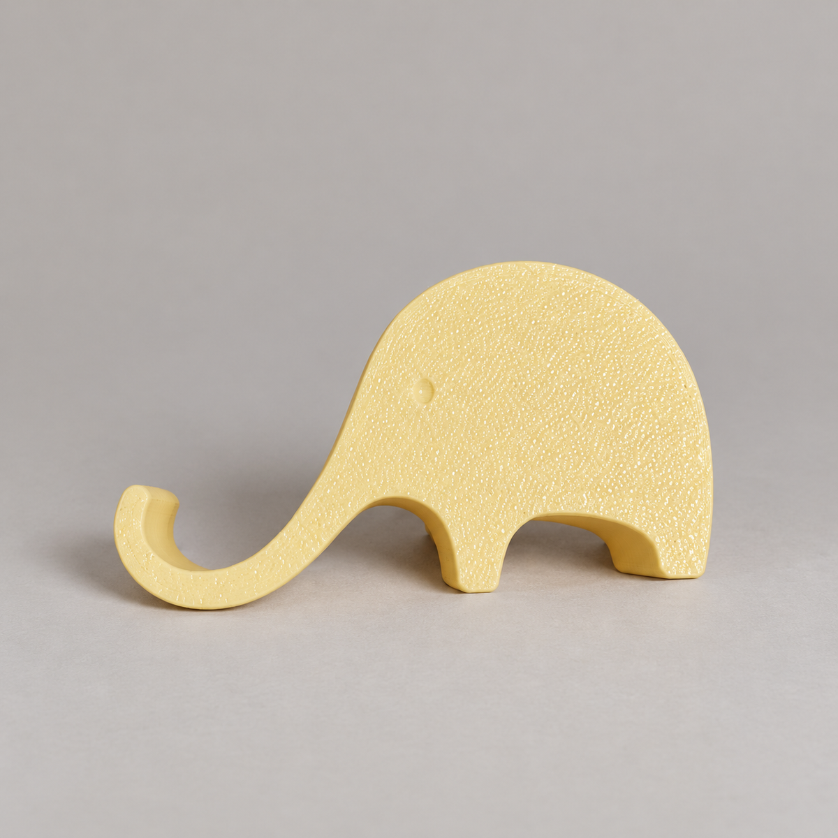 elephant-profile: original phone stand photograph, matte PLA surface and 3D printed layer details