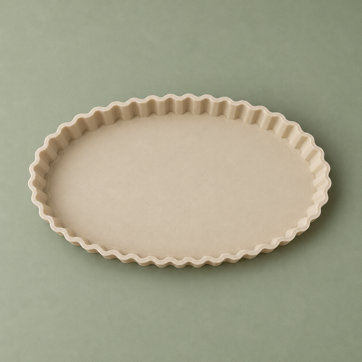 Top view of the empty beige oval tray showing the elongated shape and scalloped perimeter